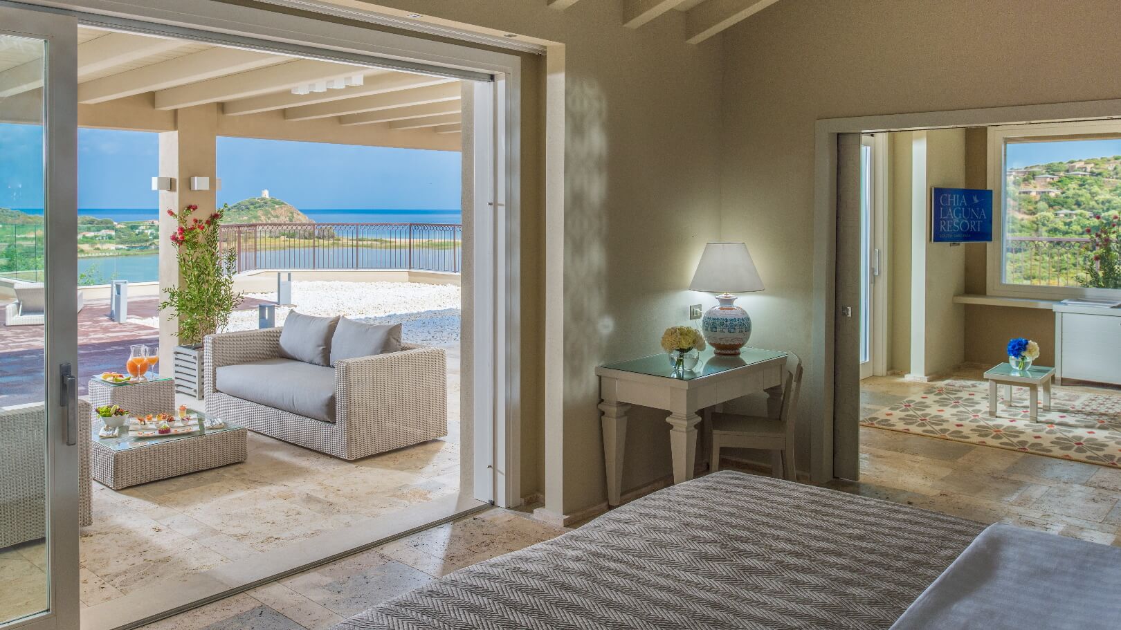 https://www.chialagunaresort.com/wp-content/uploads/2021/04/IHC_Chia-Laguna-Resort_grid_CL4U_terrace-suite.jpg